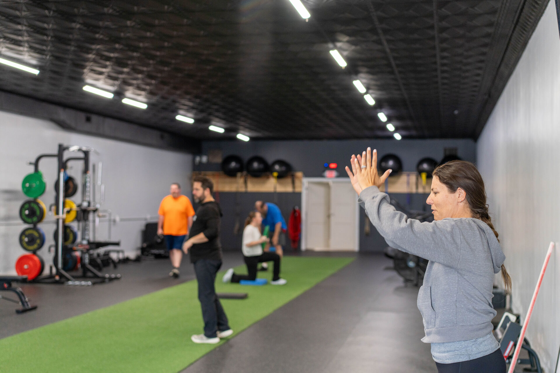 Coach leading a semi-private training session at Functional Fitness 360