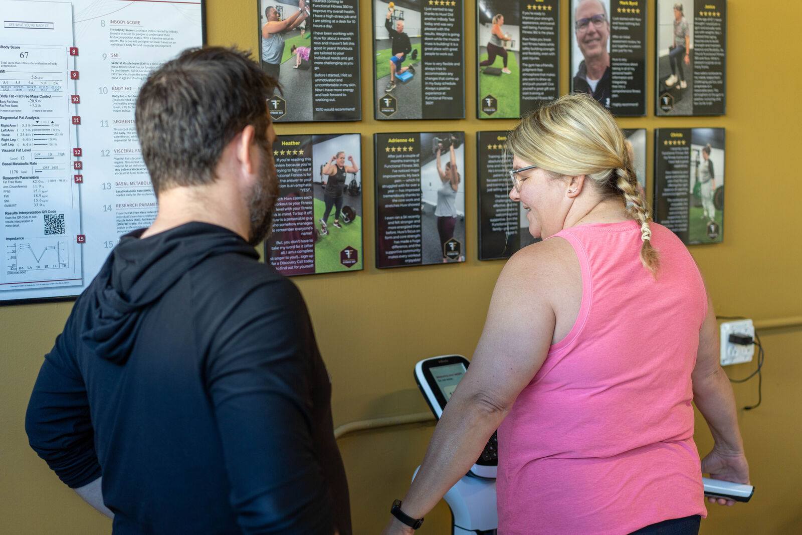 Coach and member reviewing progress together on the training board